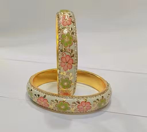 Two floral-patterned bangles on a white background